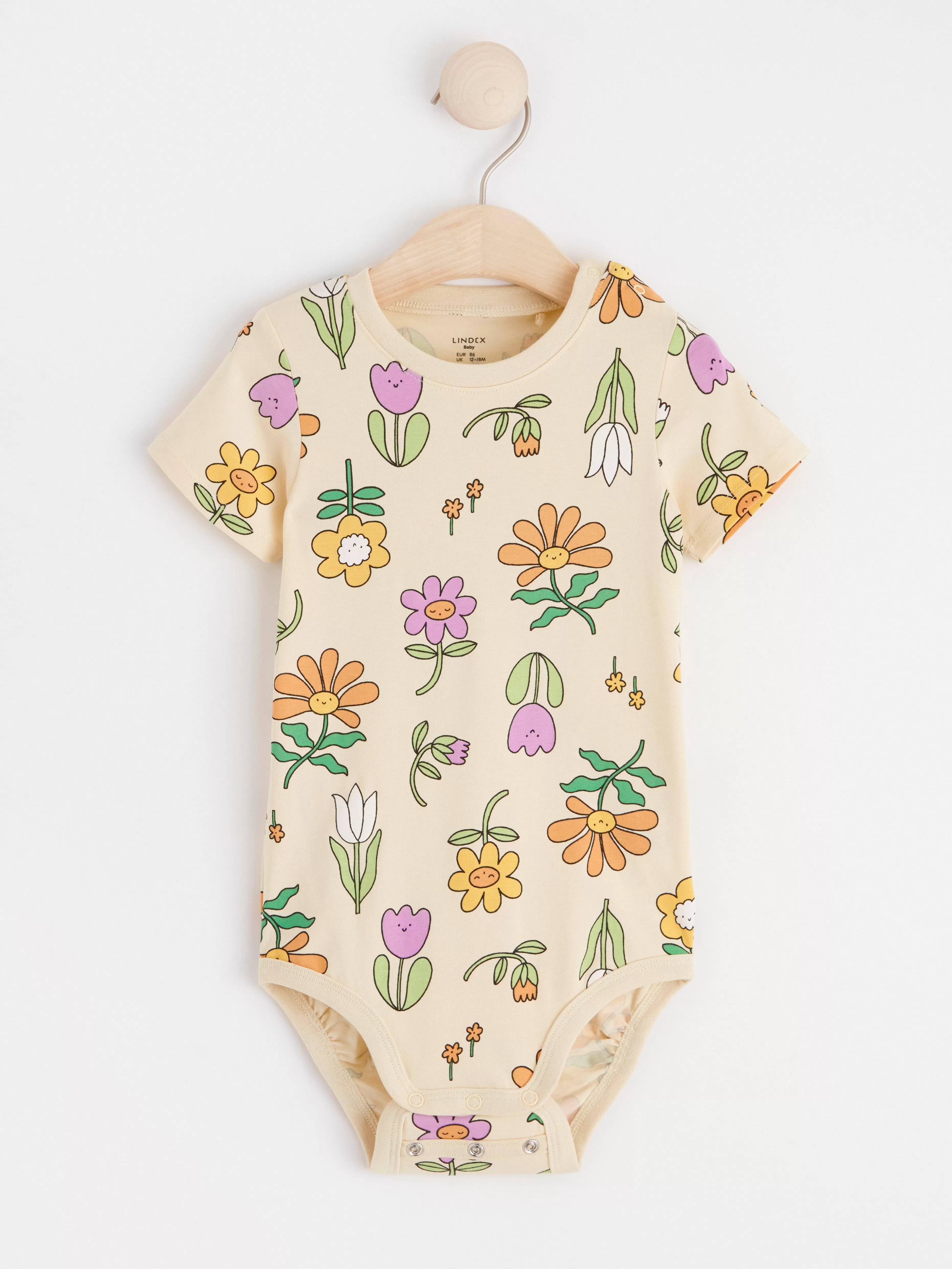 Bebis Lindex Kortarmad Body Med Blommor